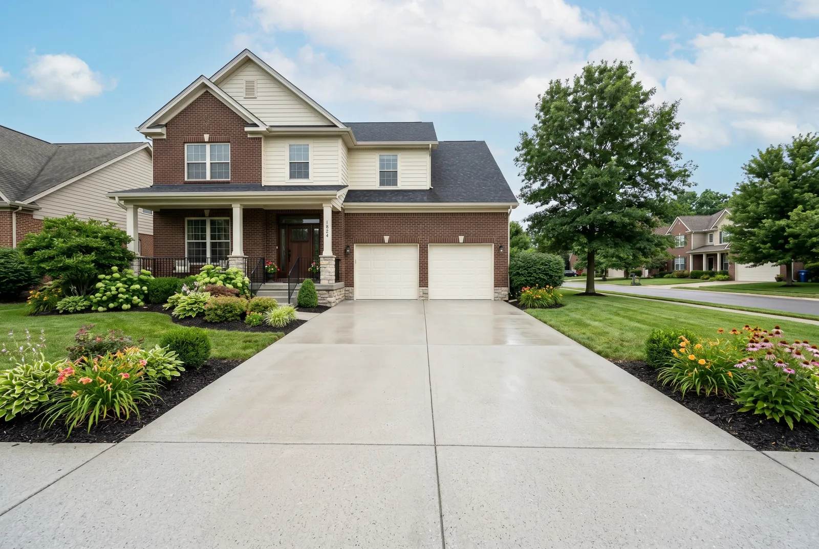 Concrete driveway after cleaning in Middletown, KY by Noah's Pressure Washing, even clean finish