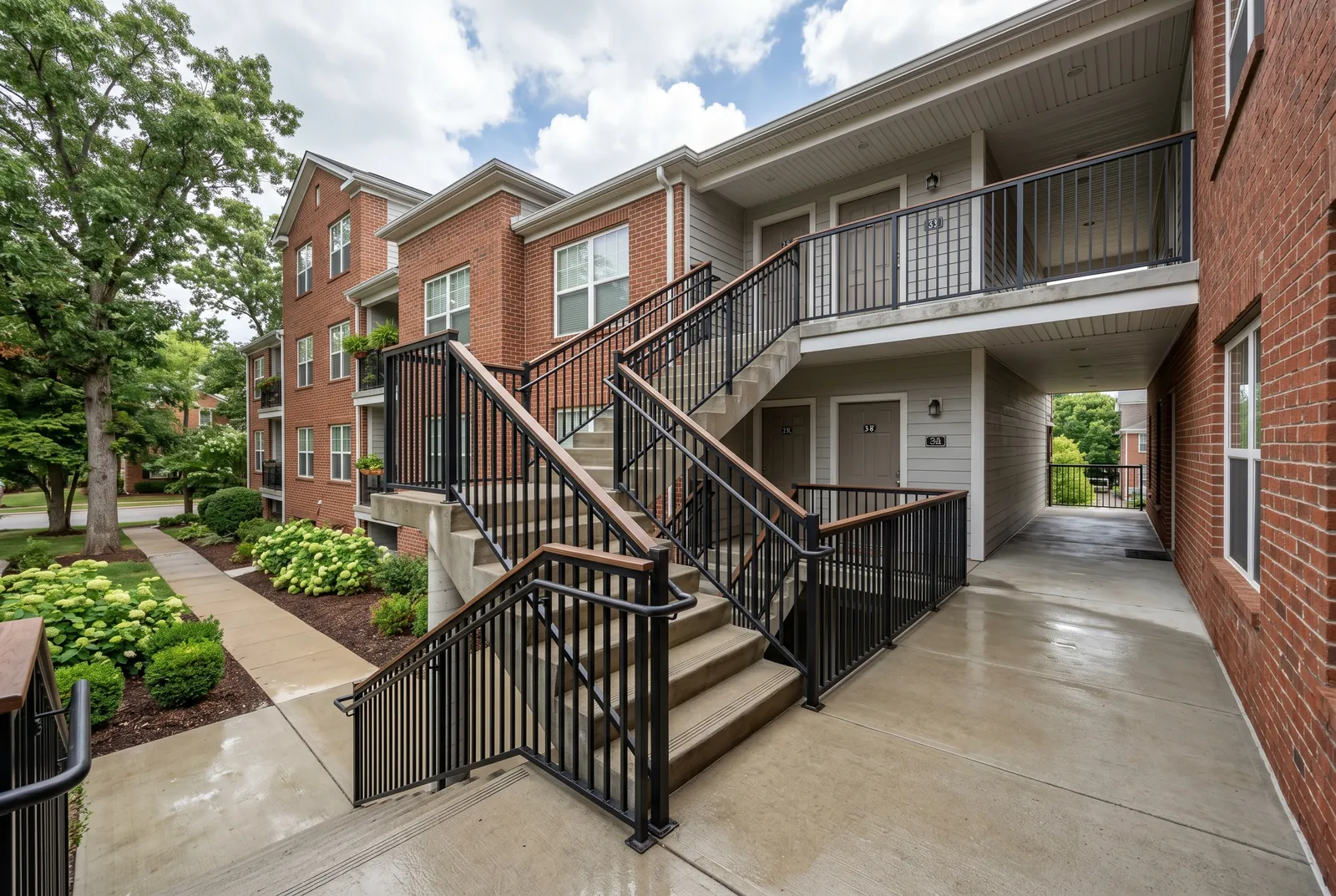 Apartment breezeway concrete after cleaning in Jeffersontown, KY by Noah's Pressure Washing, clean steps and landing
