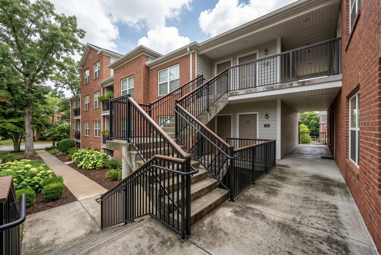 Apartment breezeway concrete before cleaning in Jeffersontown, KY, mildew and dirt on the steps