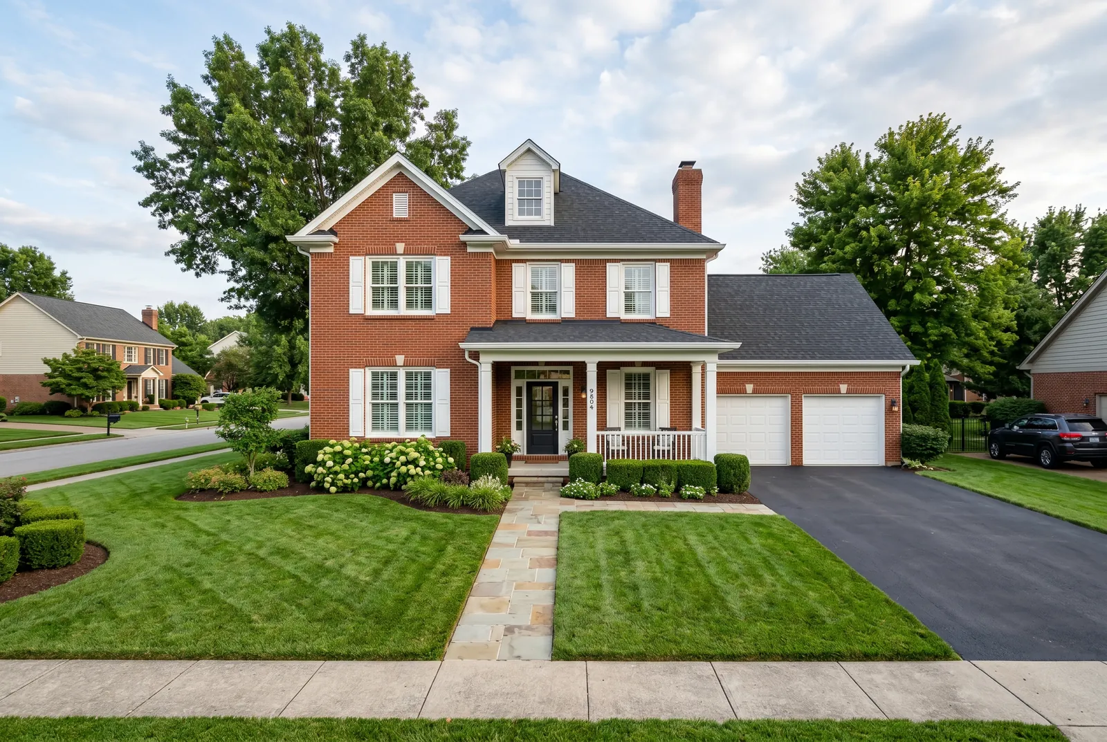Brick home after soft washing in Prospect, KY by Noah's Pressure Washing, clean brick and trim