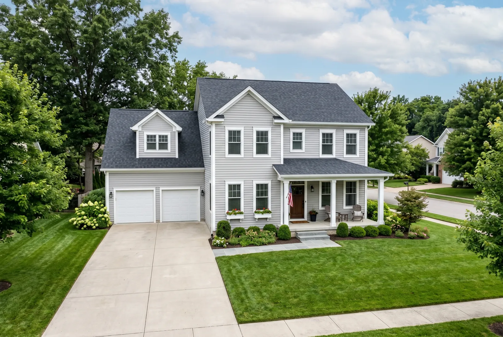 Two-story home after soft washing in St. Matthews, KY by Noah's Pressure Washing, clean vinyl siding